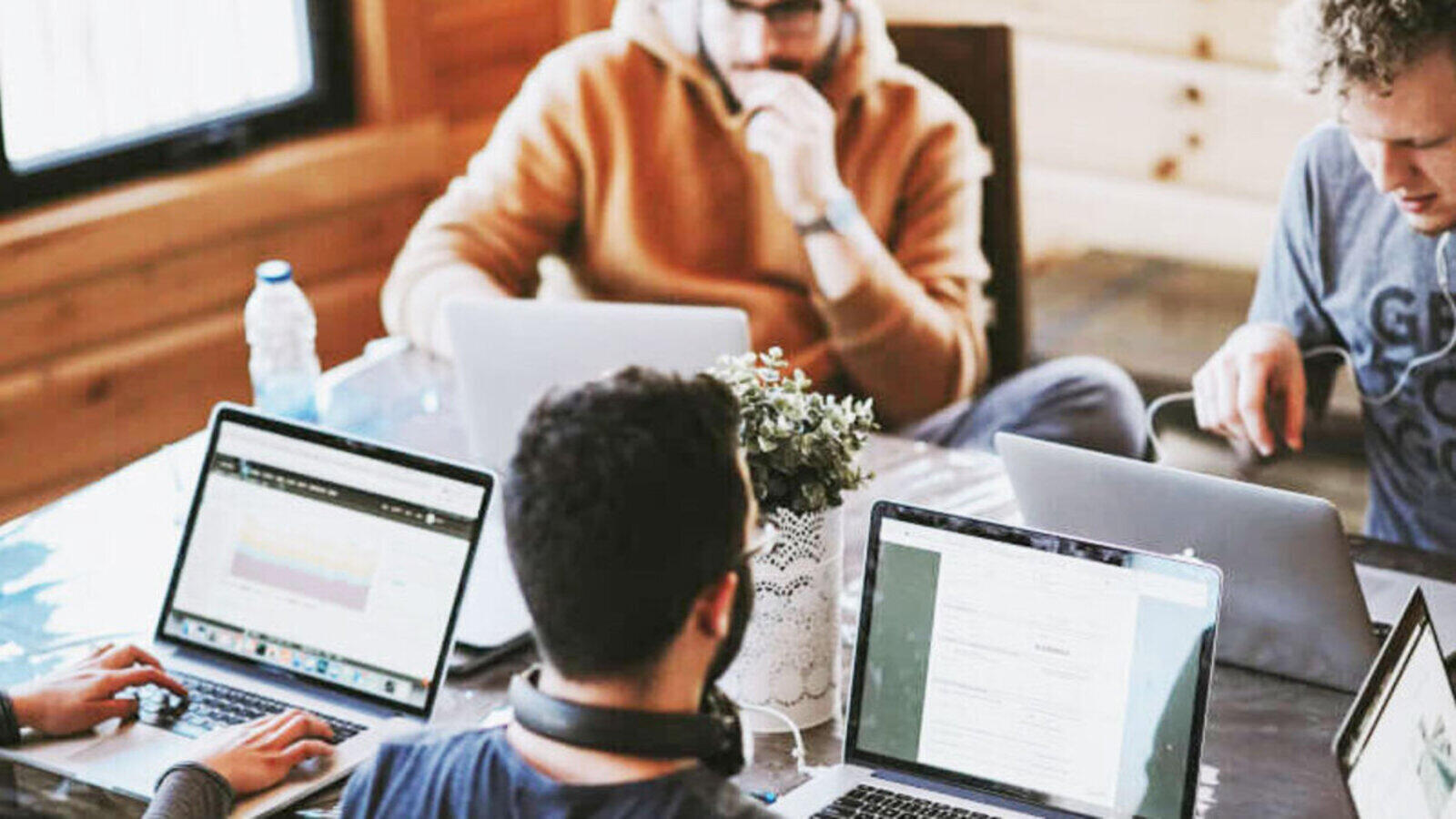 Diverse team collaborating in a bright modern office workspace